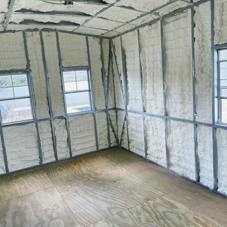 Closed-cell spray foam insulation applied to wall cavities in a residential project in Wilson